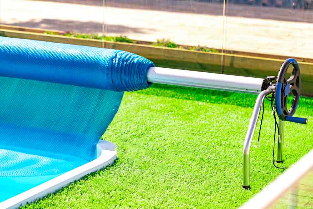 Roller Pool Cover On Green Grass
