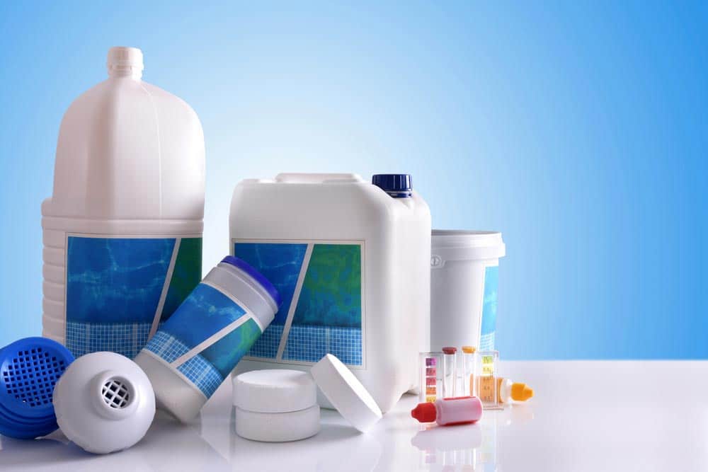 Chemical Cleaning Products On Blue Background — Hi-Tech Pools & Spas In Yarrawonga, NT