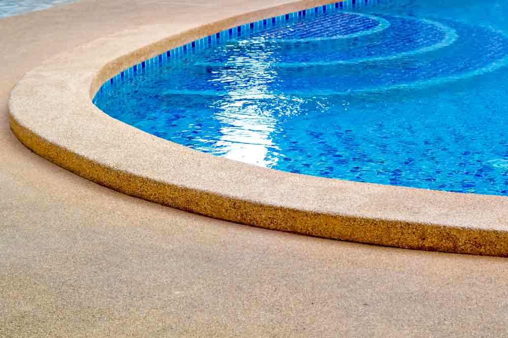 Clear Blue Water And Stone Edged Pool — Hi-Tech Pools & Spas In Yarrawonga, NT