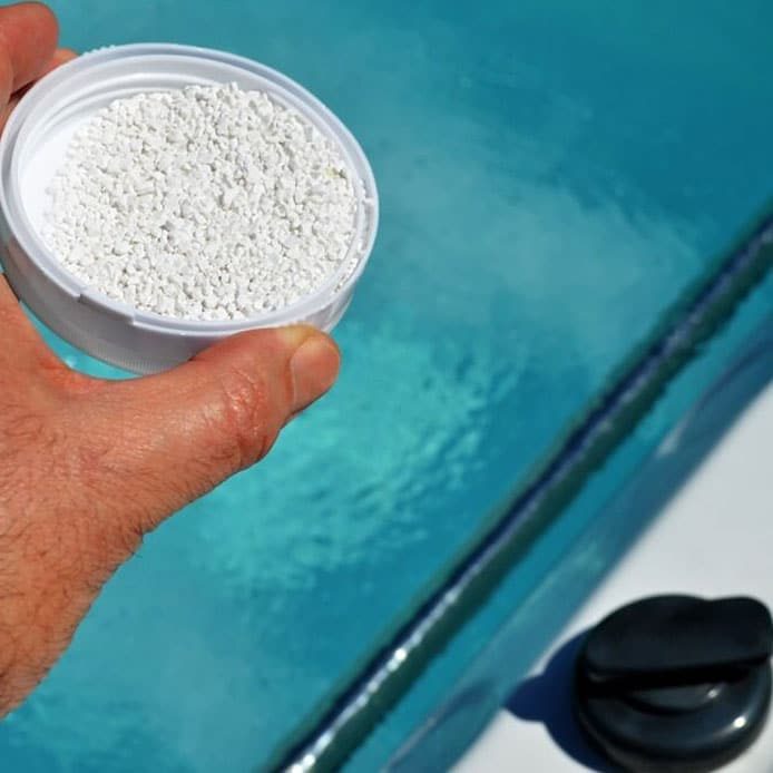Adding Chemical To Pool